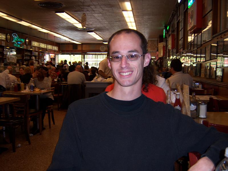 FlaNY2008May_dad03.JPG - Lunch at Katz's.   This place was in "When Harry Met Sally" and the sign hanging from the ceiling behind my right shoulder shows where "the scene" was filmed.