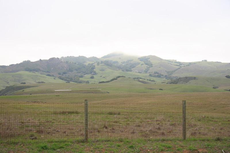 slo108.JPG - Hearst Castle.  View of the castle (behind the clouds) from the visitor center.