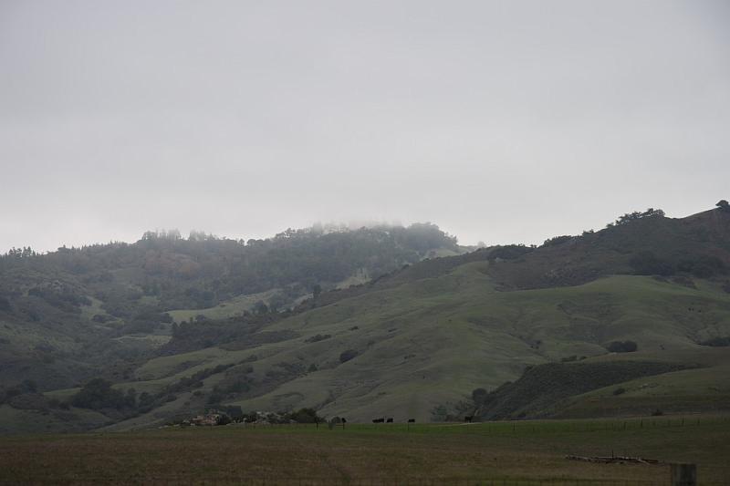 slo109.JPG - Hearst Castle.  View of the castle (behind the clouds) from the visitor center.